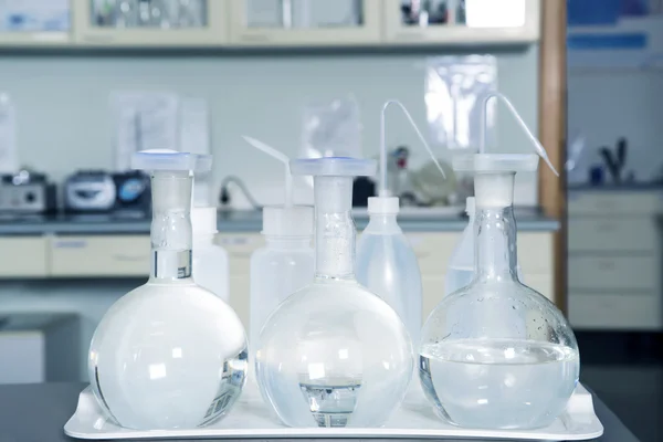 Laboratory equipment, glass flasks in laboratory interior.