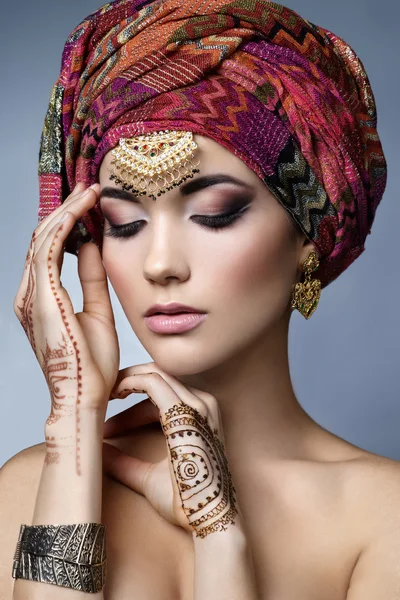 Beautiful fashion east  woman portrait with oriental accessories