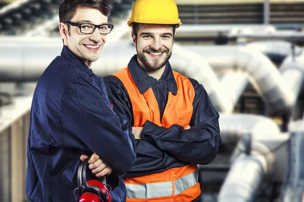 Smiling workers in protective uniform