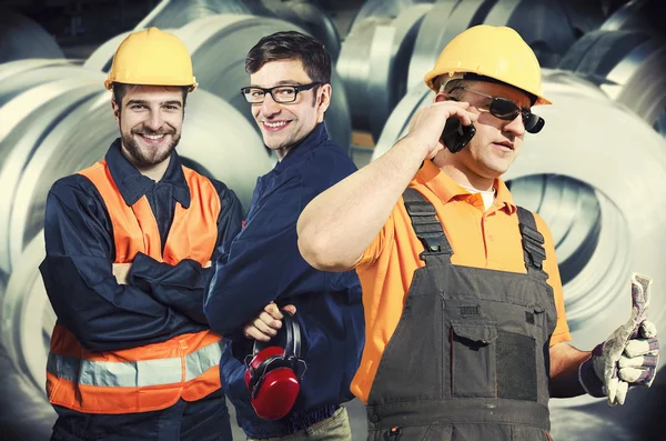 Smiling workers in protective uniforms
