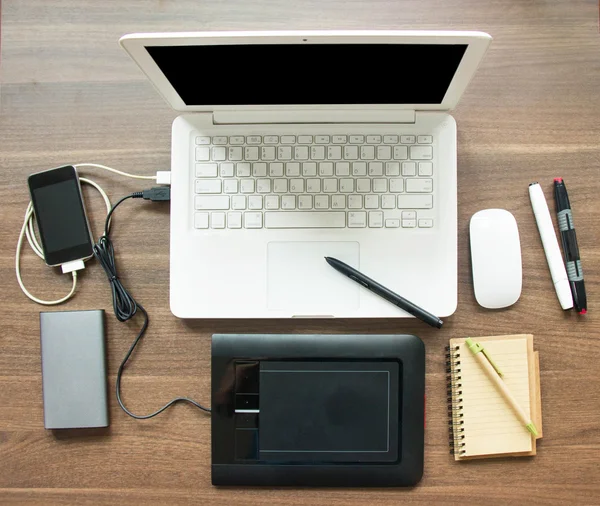 Top View Table Workspace With Laptop And Equipment For Sync