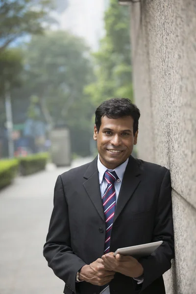 Indian businessman using tablet