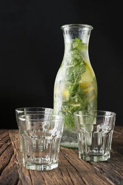 Bottle of soda and drinking glasses