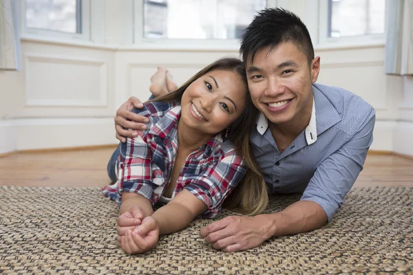 Chinese couple posing together at home