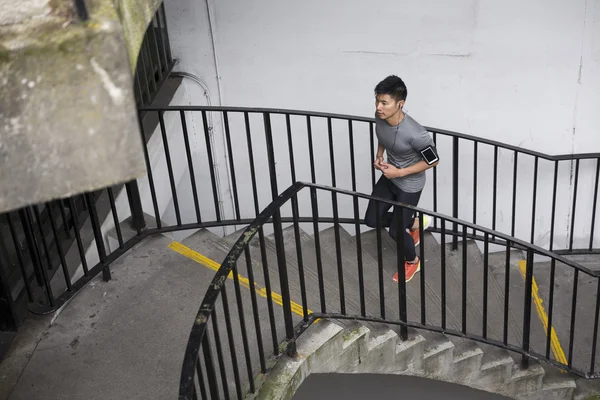 Chinese man running up stairs