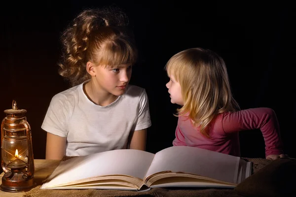 Two sisters tell each other scary stories at night