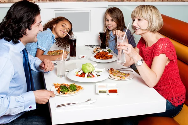 Family eating together in restaurant