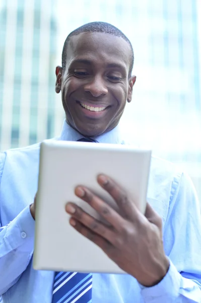 Businessman working in his digital tablet