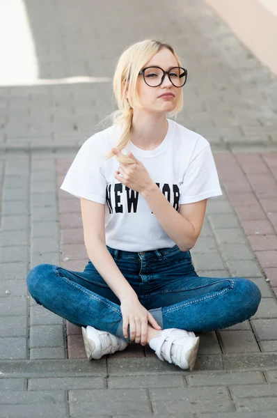 Outdoor portrait of young stylish hipster girl. American, blonde, beautiful smile, white teeth, sunglasses, New York, happiness, relax, enjoy summer