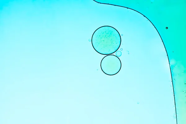Oil bubbles abstract blue background