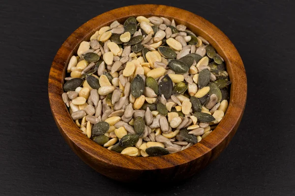 Mixed seeds in wooden bowl