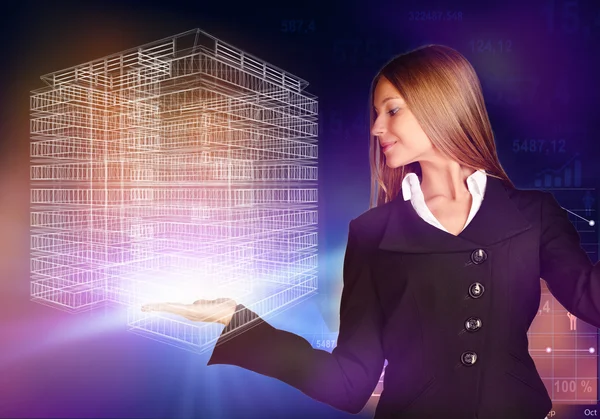 Business woman holding a wireframe house on the hand.
