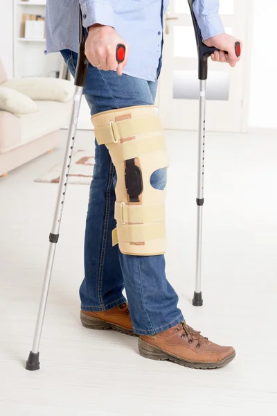 Man with leg in knee cages