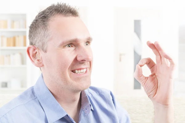 Deaf man using sign language