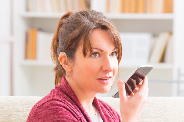 Deaf woman using sign language on the smartphone