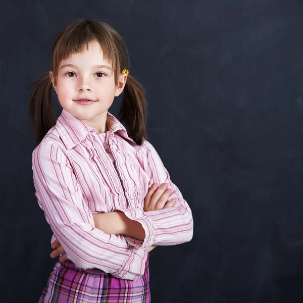 Schoolchild on blackboard background