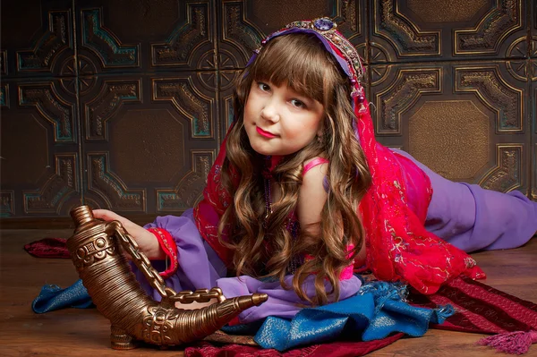Little girl in oriental costume dancing