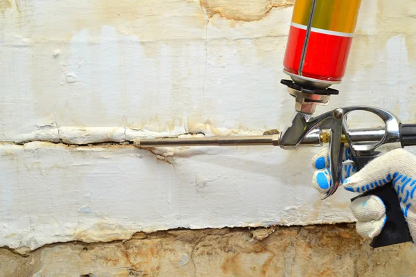 Wall repair by construction foam