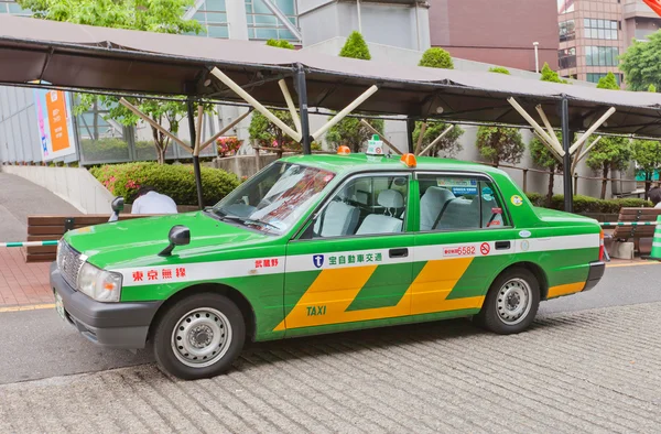Green taxi waiting passenger in Tokyo, Japan