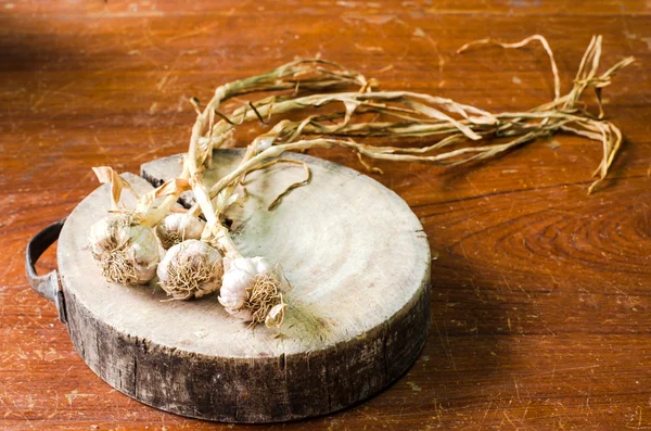 Wood cutting board with garlic