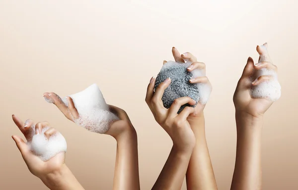 Woman hands with soap foam