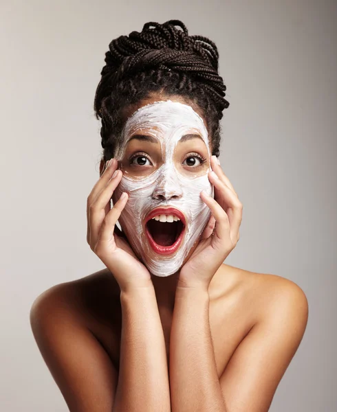 Woman have fun with facial treatment