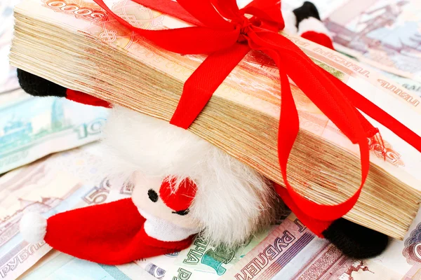Toy Santa with money stack