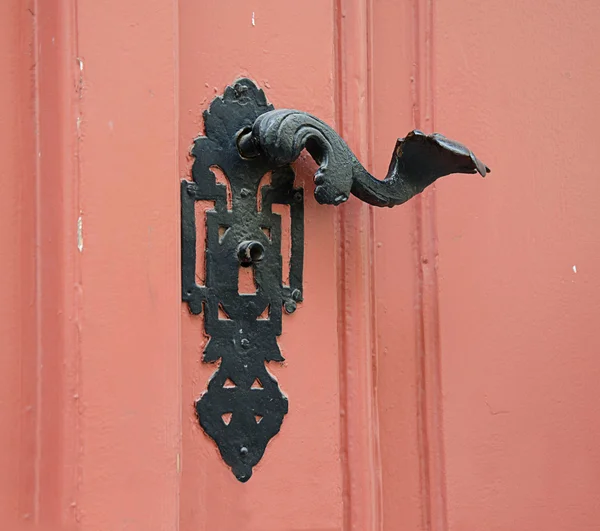 Door handle on the wooden  door .