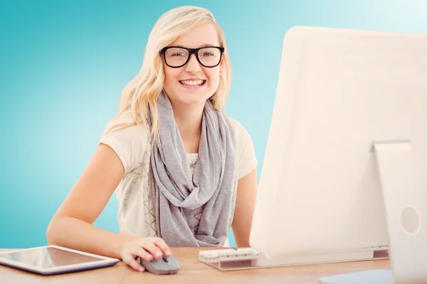 Smiling woman using computer