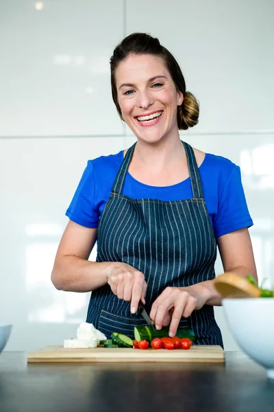 Woman preparing vegetables for dinner