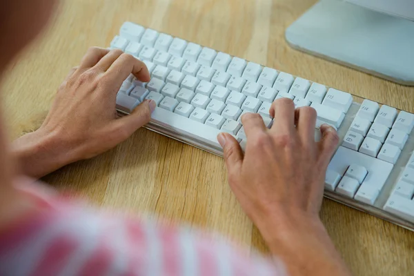 Female hands typing on  a keyboard