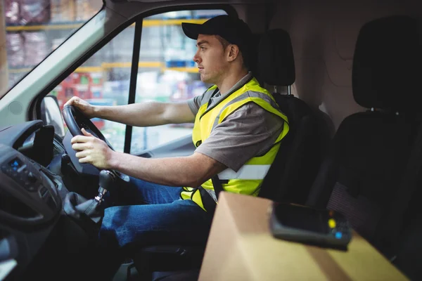 Delivery driver driving van