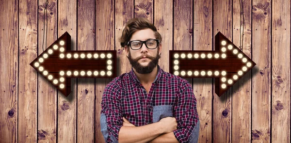 Hipster wearing eye glasses with arms crossed