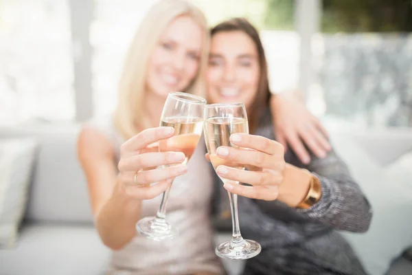 Women toasting champagne flutes