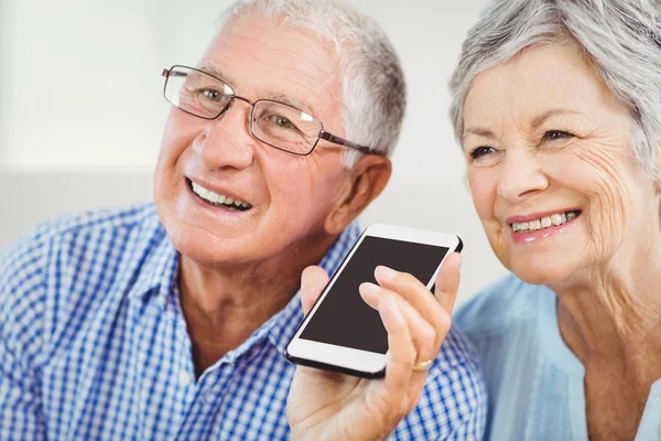 Senior couple talking on phone
