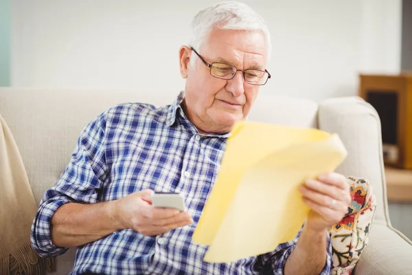 Senior man looking at document