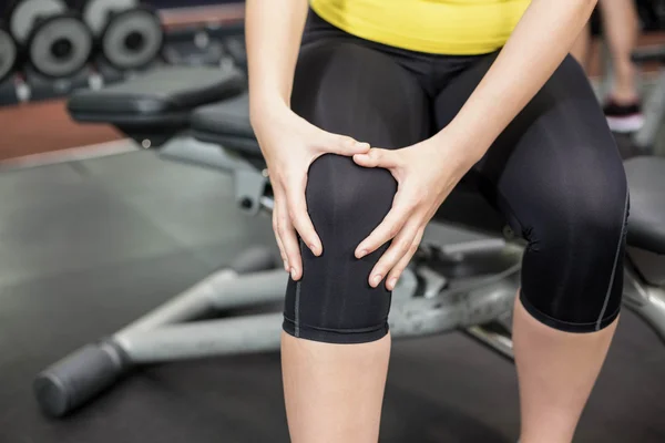 Fit woman having knees pain