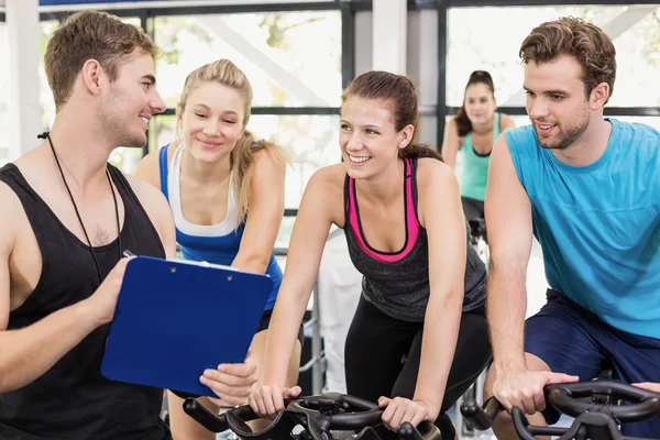 People using exercise bike together