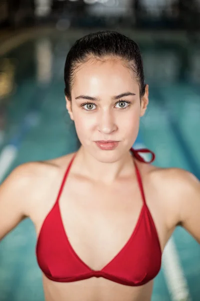 Brunette in swimsuit with hands on hips