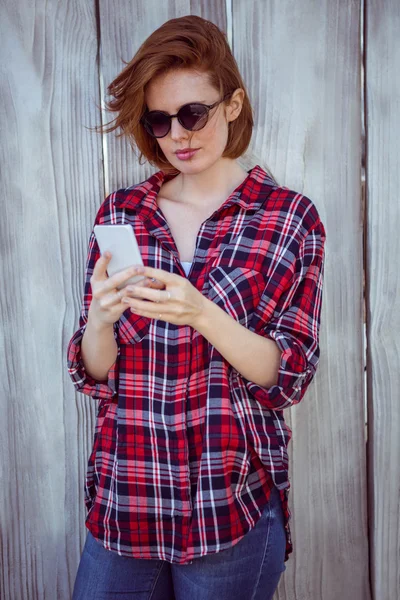 Hipster woman looking at phone