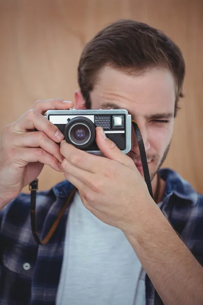 Handsome hipster taking picture