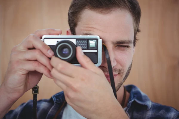 Handsome hipster taking picture