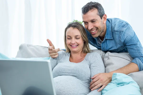 Couple looking at laptop