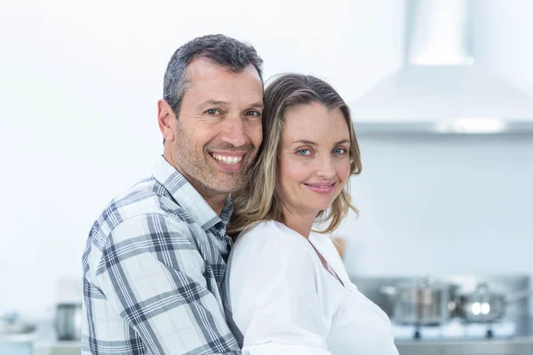 Pregnant couple in kitchen