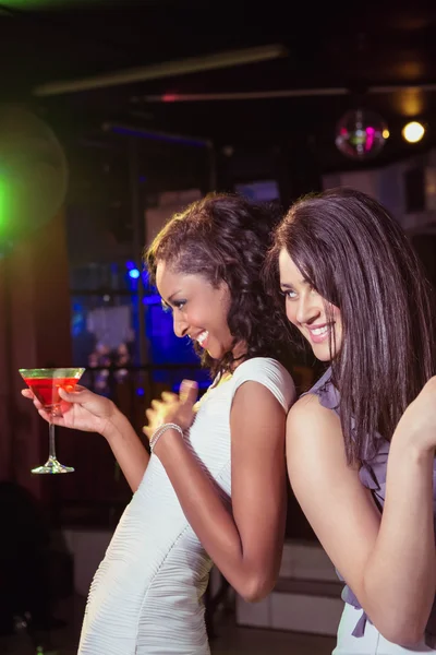 Happy young women having red cocktail