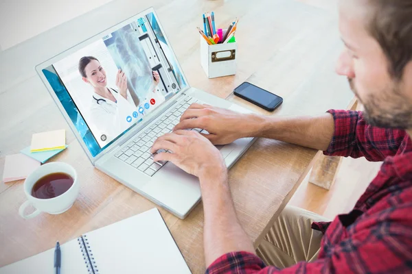 Creative businessman typing on laptop