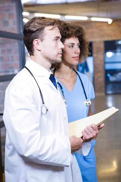 Doctor and nurse with medical report