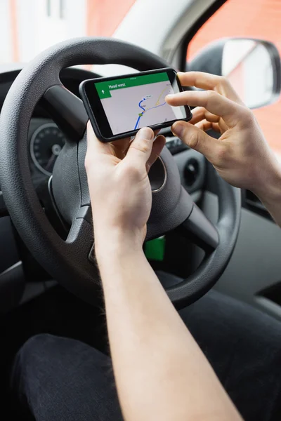 Man using  smartphone as navigation system