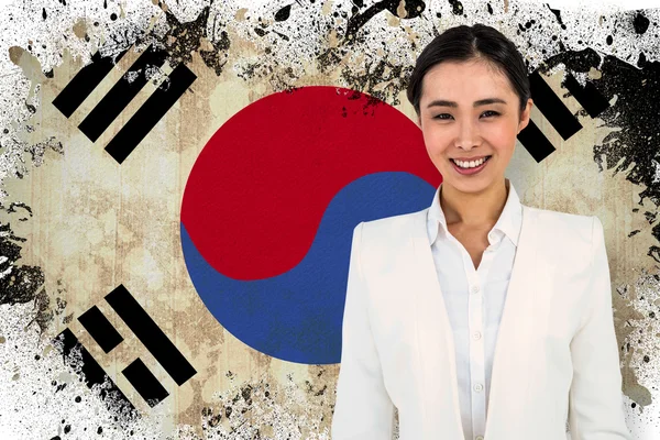 Smiling businesswoman against korea republic flag