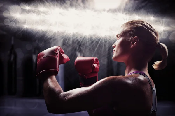 Female boxer with fighting stance